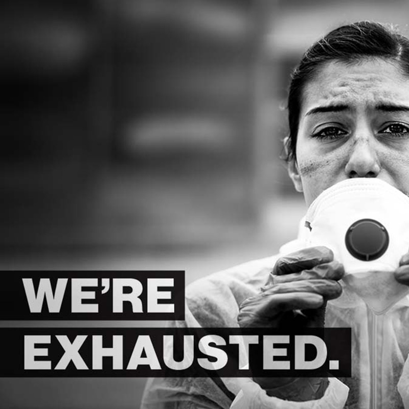 Socal graphic from Community Health Network that says We’re exhausted featuring a woman in full PPE encouraging Hoosiers to get their dose of the COVID-19 vaccine.
