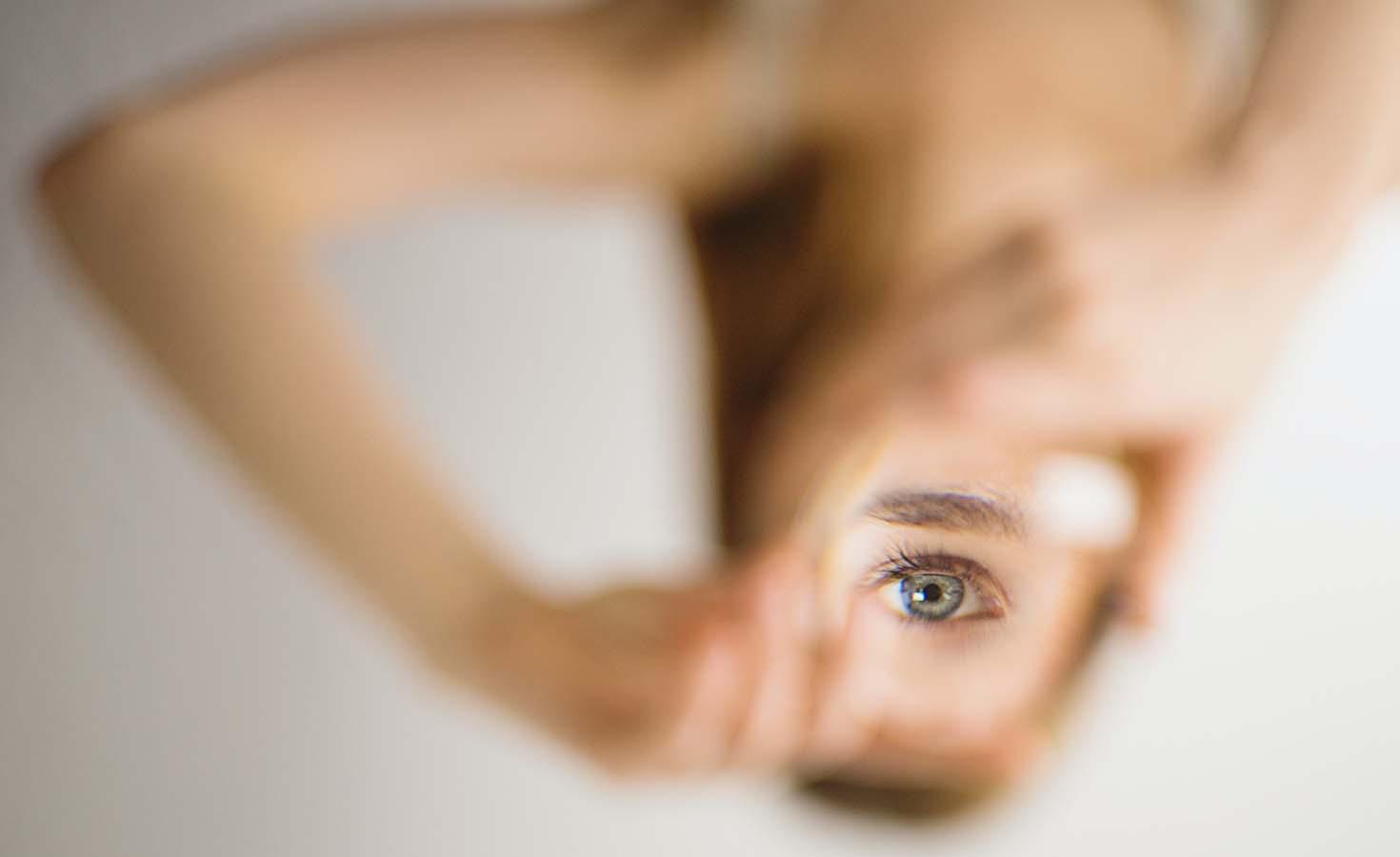 Blurred image with focus on woman's eye