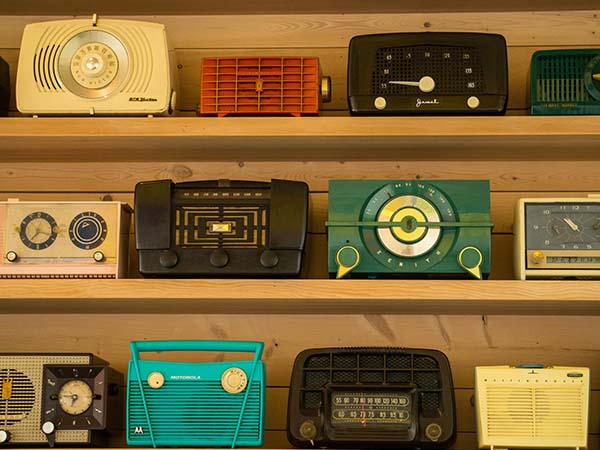 Shelf filled with old radios